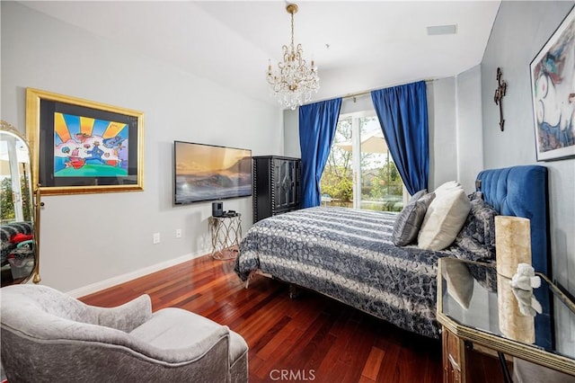 bedroom featuring wood-type flooring, a chandelier, and baseboards