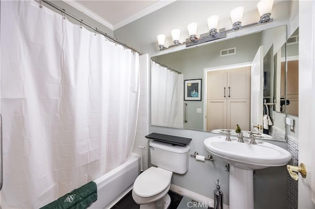 bathroom with crown molding, shower / bath combination with curtain, and toilet