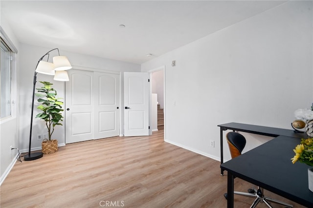 office space featuring wood finished floors and baseboards