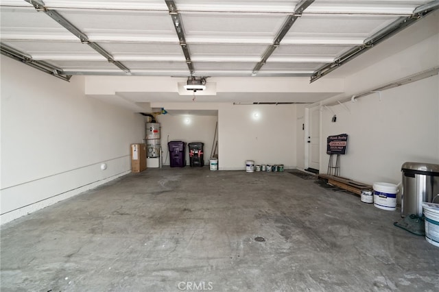 garage with strapped water heater and a garage door opener