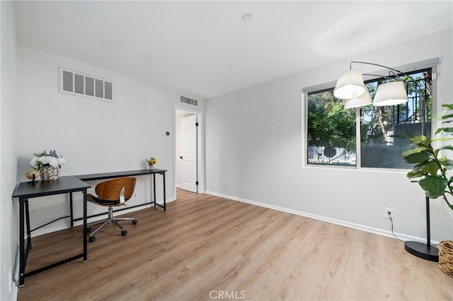 office featuring wood finished floors and baseboards
