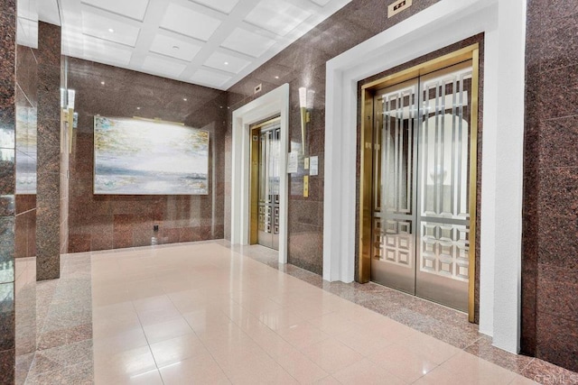 corridor with tile patterned floors, elevator, recessed lighting, and beam ceiling
