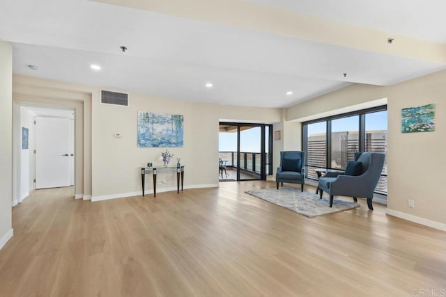 sitting room featuring light wood-style flooring, baseboards, and recessed lighting