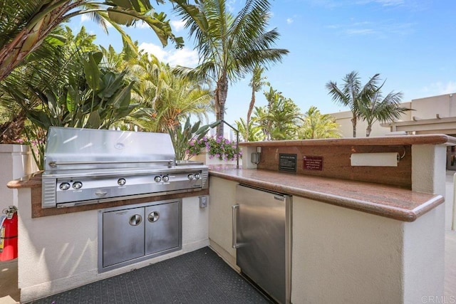 view of patio with a grill and area for grilling