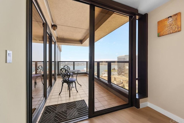 balcony featuring a water view
