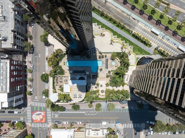 aerial view of property's location featuring a pool area