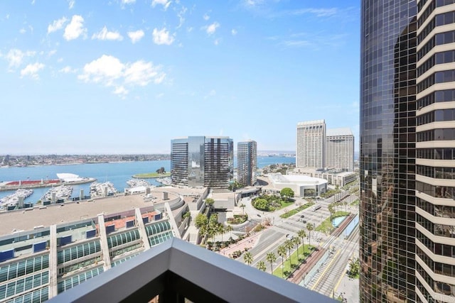 balcony featuring a water view and a view of city