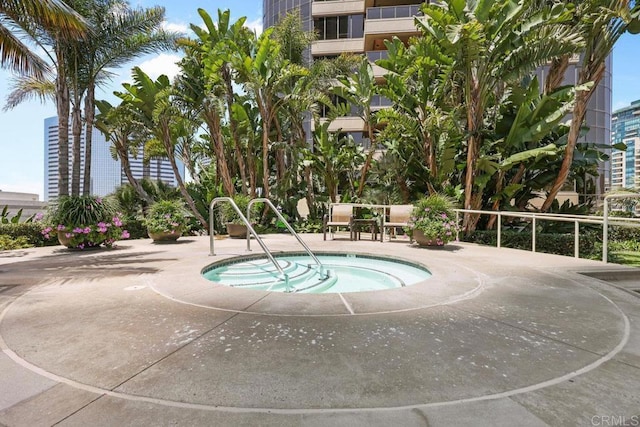 view of swimming pool featuring a community hot tub