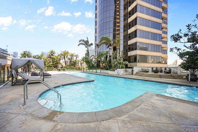 community pool featuring a patio area