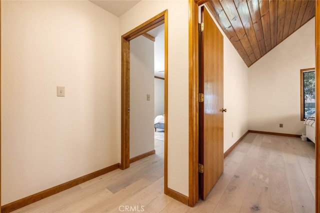 2604 Veneman Ave, Modesto, CA 95356 - hallway with light wood-style flooring, lofted ceiling, baseboards, and wooden ceiling