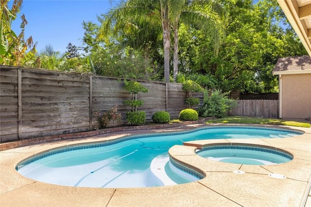 2604 Veneman Ave, Modesto, CA 95356 - view of pool with a fenced backyard and an in-ground hot tub