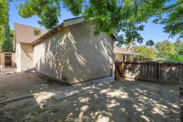 2604 Veneman Ave, Modesto, CA 95356 - back of house featuring stucco siding and fence