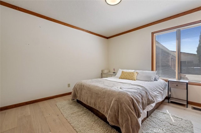 2604 Veneman Ave, Modesto, CA 95356 - bedroom with light wood-style flooring, baseboards, and ornamental molding