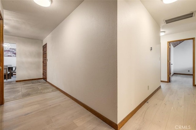 2604 Veneman Ave, Modesto, CA 95356 - hallway with baseboards and light wood-type flooring
