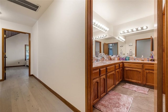 2604 Veneman Ave, Modesto, CA 95356 - bathroom featuring double vanity and baseboards