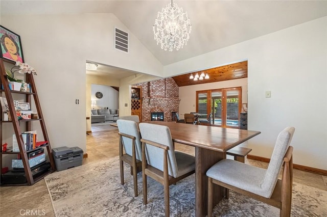 2604 Veneman Ave, Modesto, CA 95356 - dining room with a chandelier, high vaulted ceiling, and a fireplace