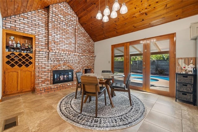 2604 Veneman Ave, Modesto, CA 95356 - dining area featuring high vaulted ceiling, wood ceiling, light tile patterned floors, and a fireplace