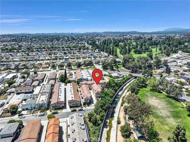 aerial view of property and surrounding area with nearby suburban area