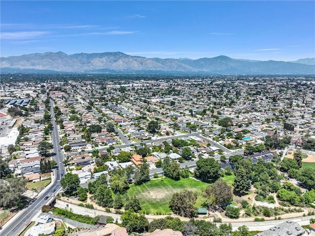 aerial view of residential area featuring mountains