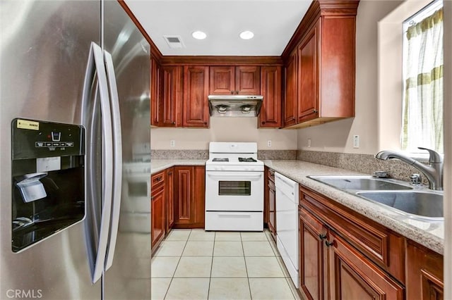 kitchen featuring white appliances, a sink, under cabinet range hood, light tile patterned floors, and recessed lighting