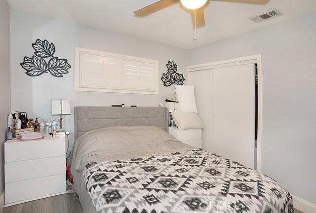 885 N Millard Ave, Rialto, CA 92376 - bedroom featuring a closet, wood finished floors, and ceiling fan