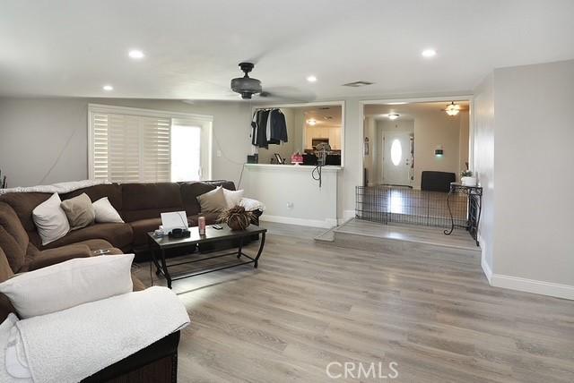 885 N Millard Ave, Rialto, CA 92376 - living room featuring a ceiling fan, light wood-style flooring, baseboards, and recessed lighting