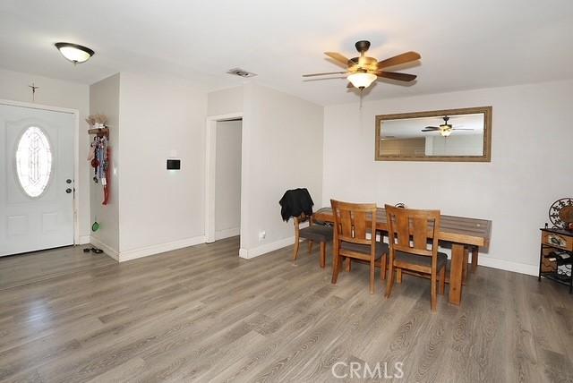 885 N Millard Ave, Rialto, CA 92376 - dining room with wood finished floors, a ceiling fan, and baseboards