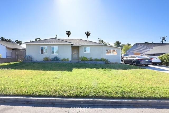 885 N Millard Ave, Rialto, CA 92376 - view of front facade featuring a front lawn and stucco siding