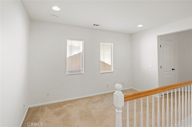 carpeted spare room with baseboards and recessed lighting