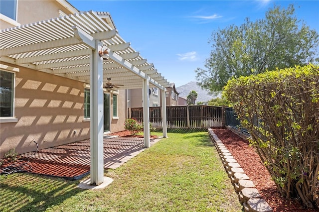 view of yard with a pergola, a patio, and a ceiling fan