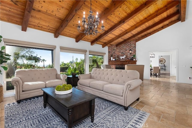 living area with wooden ceiling, a chandelier, stone tile flooring, beamed ceiling, and high vaulted ceiling