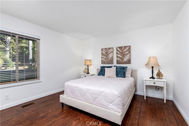 6731 Via De La Reina, Bonsall, CA 92003 - bedroom with hardwood / wood-style flooring and baseboards