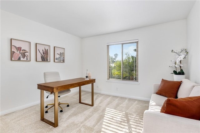 home office featuring light colored carpet and baseboards