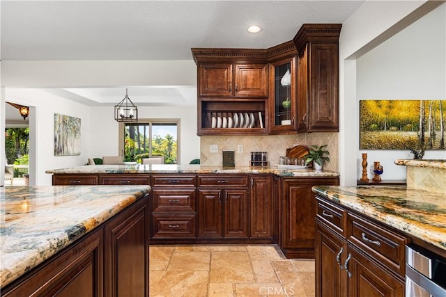 bar area with backsplash, recessed lighting, stone tile flooring, and a chandelier