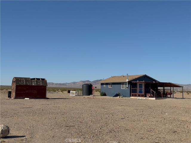 rear view of house with a mountain view