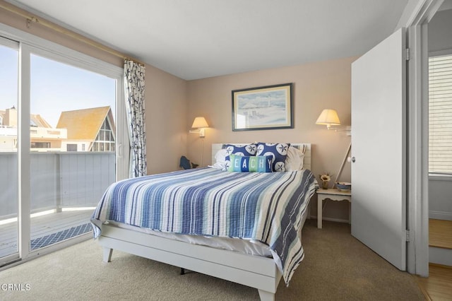 325 Ocean Dr, Oxnard, CA 93035 - carpeted bedroom featuring multiple windows, access to outside, and baseboards