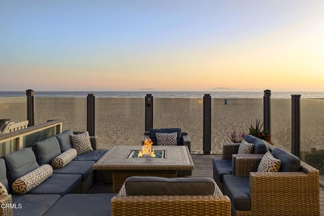 325 Ocean Dr, Oxnard, CA 93035 - view of patio featuring a water view and an outdoor living space with a fire pit