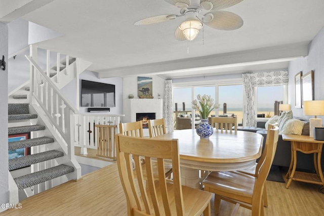 325 Ocean Dr, Oxnard, CA 93035 - dining area featuring wood finished floors, healthy amount of natural light, a ceiling fan, and stairs