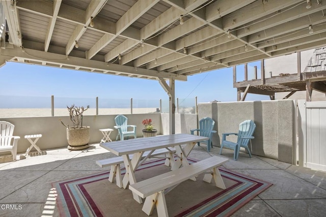 325 Ocean Dr, Oxnard, CA 93035 - view of patio featuring fence, outdoor dining area, and a water view