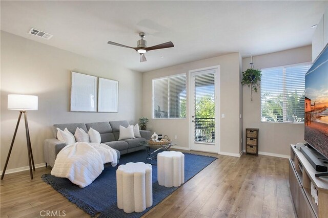 2651 W Lincoln Ave Unit 40, Anaheim, CA 92801 - living room with light wood-style floors, ceiling fan, and baseboards