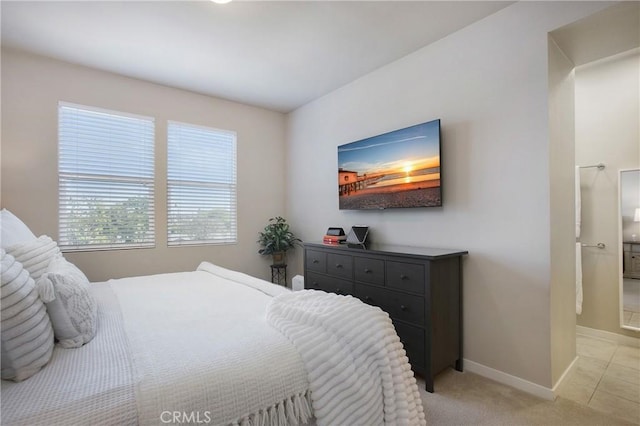 2651 W Lincoln Ave Unit 40, Anaheim, CA 92801 - bedroom with baseboards, light colored carpet, and connected bathroom