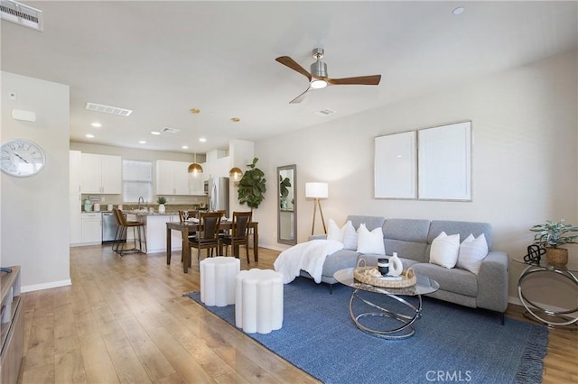 2651 W Lincoln Ave Unit 40, Anaheim, CA 92801 - living area featuring light wood-style floors, ceiling fan, and recessed lighting