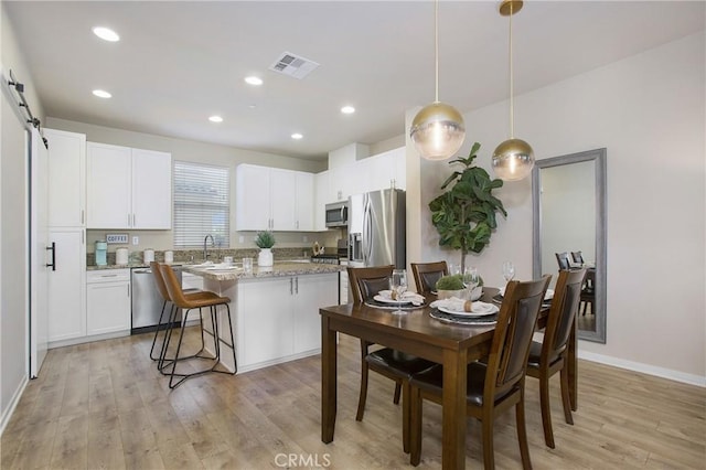 2651 W Lincoln Ave Unit 40, Anaheim, CA 92801 - dining area featuring light wood-style flooring, baseboards, and recessed lighting