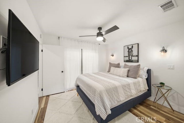 bedroom featuring light wood-style floors and ceiling fan