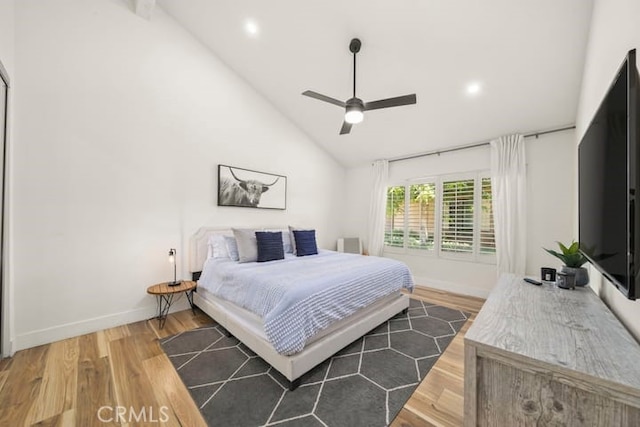 bedroom with wood finished floors, baseboards, recessed lighting, high vaulted ceiling, and ceiling fan
