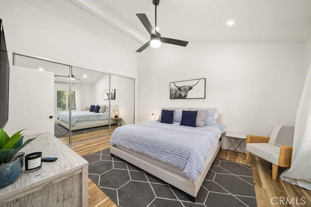 bedroom with wood finished floors, a closet, recessed lighting, vaulted ceiling, and a ceiling fan
