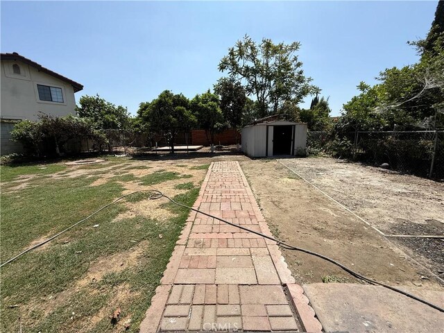 view of yard with a storage unit and an outdoor structure
