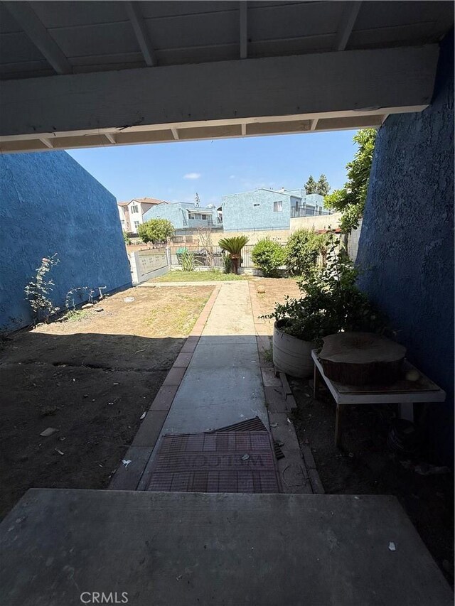 view of patio featuring fence