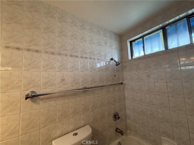 full bath featuring shower / tub combination and toilet