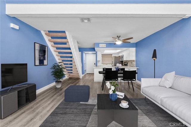 237 Oahu Way, Placentia, CA 92870 - living room featuring stairway, light wood finished floors, and a ceiling fan